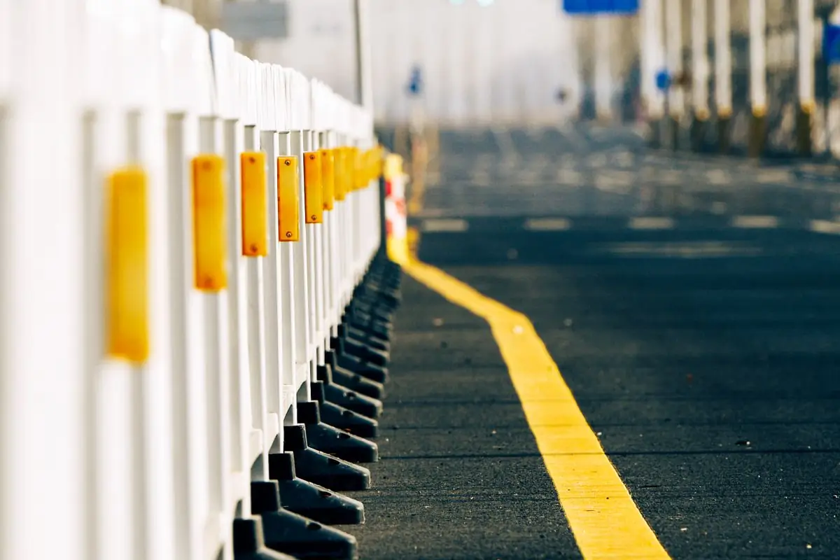 White barrier sections lining a closed street